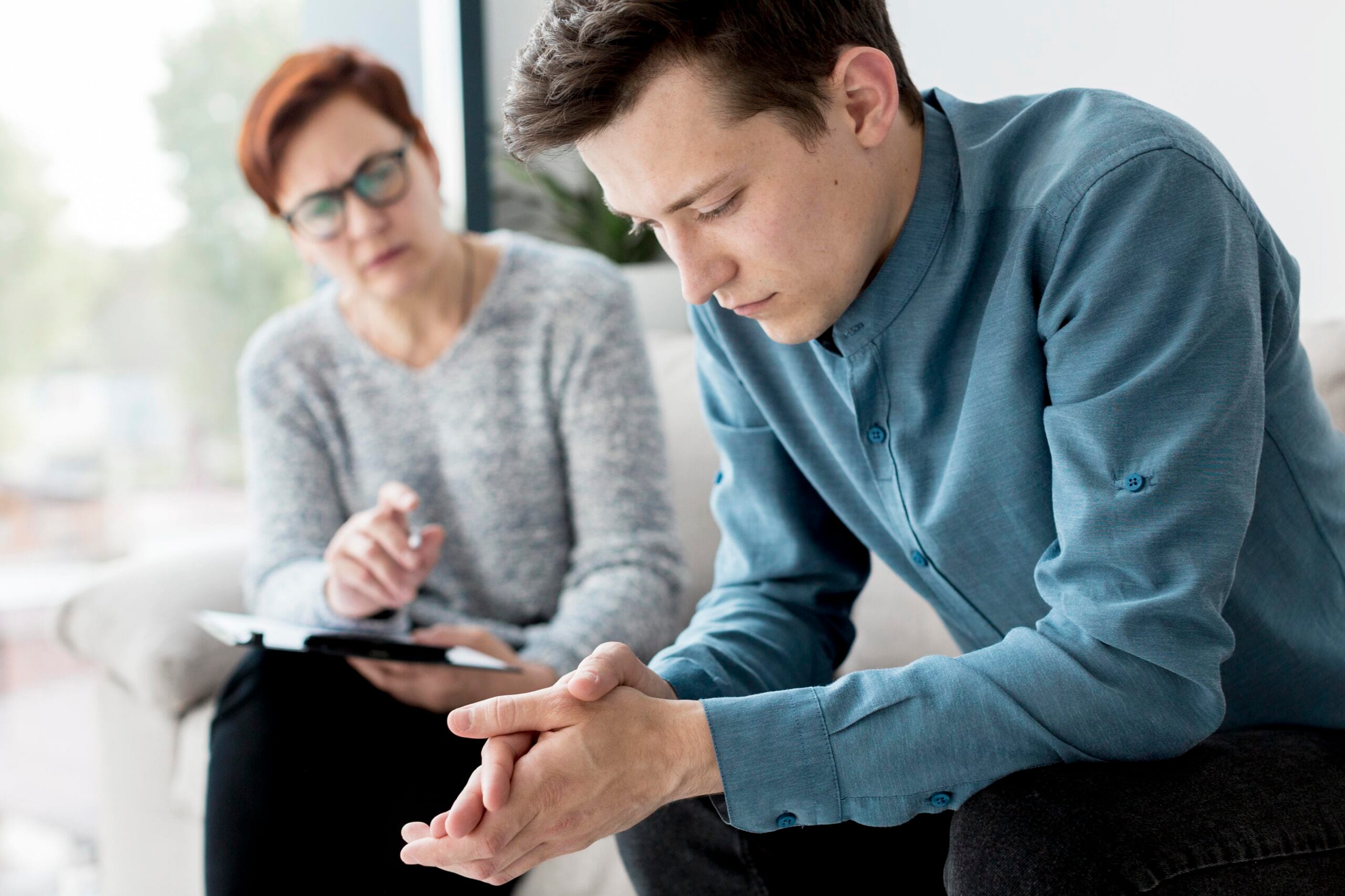 A supportive group session representing the first confidential call about recovery mentoring in Los Angeles