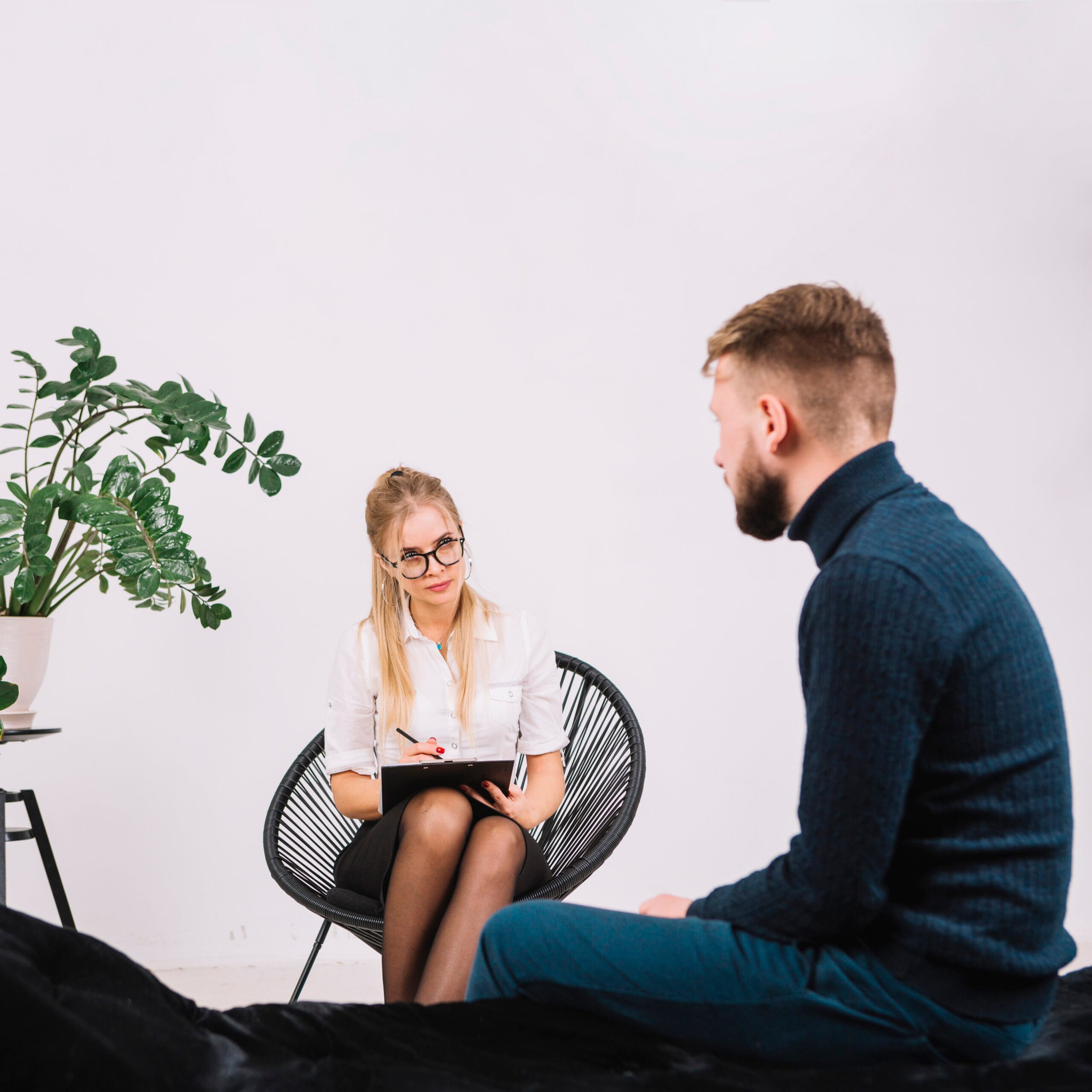 A psychologist having a session with a patient in a quiet office